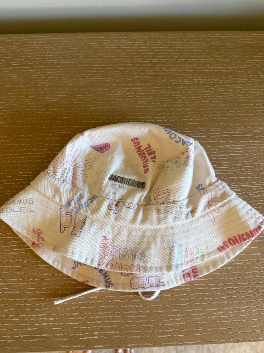 Jacquemus Cream Bucket Hat with Multicolor Logo Print - size 60
